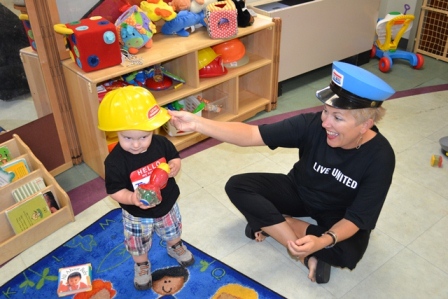 Director of Children & Family Services Gina Meier-Hummel tried on hats with a new friend.