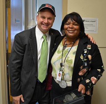 Dr. New has been principal for two years. She knows student's names, asks how they're doing, and helps them suceed. Nice hat!