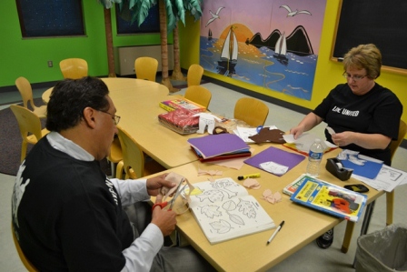 Deputy Secretary Pedro Moreno and Secretary to the Secretary Patti Cazier helped teachers by preparing classroom materials.