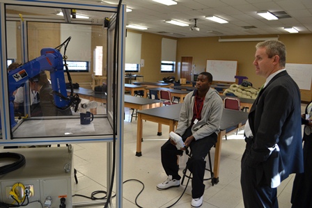 First stop, robotics class! These students are learning to design and engineer tasks like pouring water as seen here.