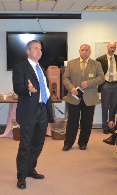 SRS Secretary Rob Siedlecki, left, with Senator Allen Schmidt, D-Hays and Larned Interim Superintendent Christopher Burke.