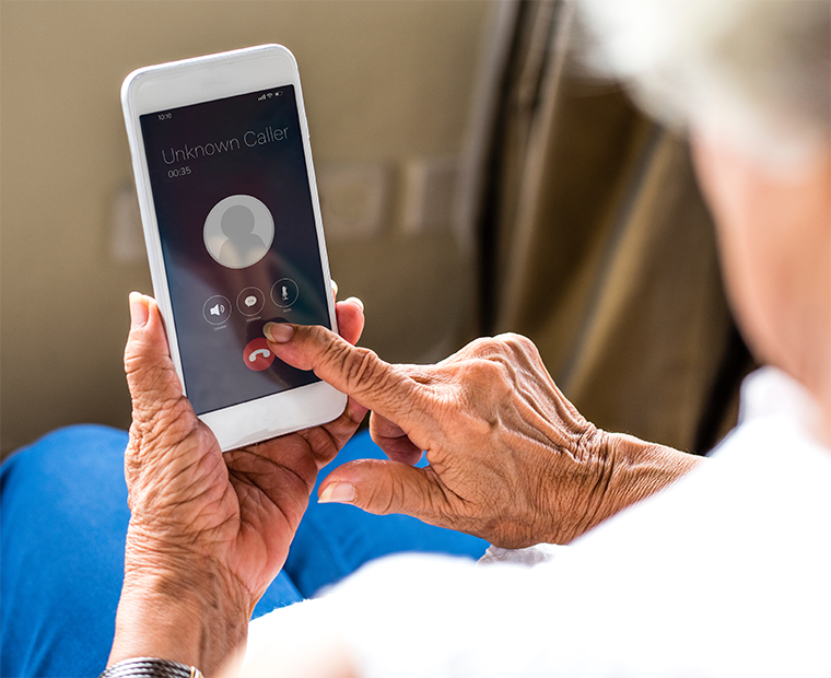 Image of a woman on phone, disconnecting the unknown caller call